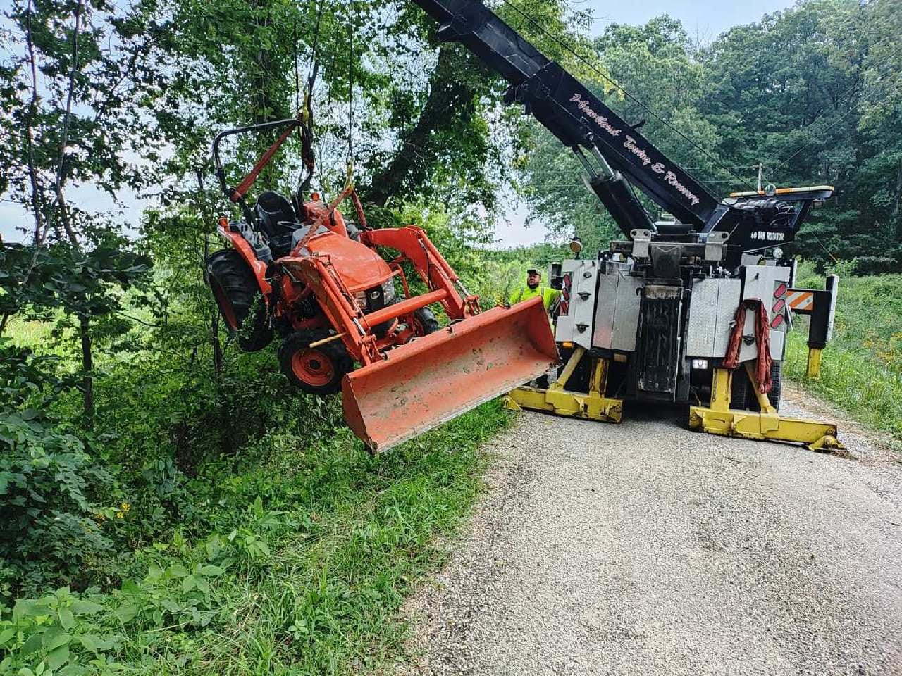 Heartland Towing recovering a compact tractor from a ditch